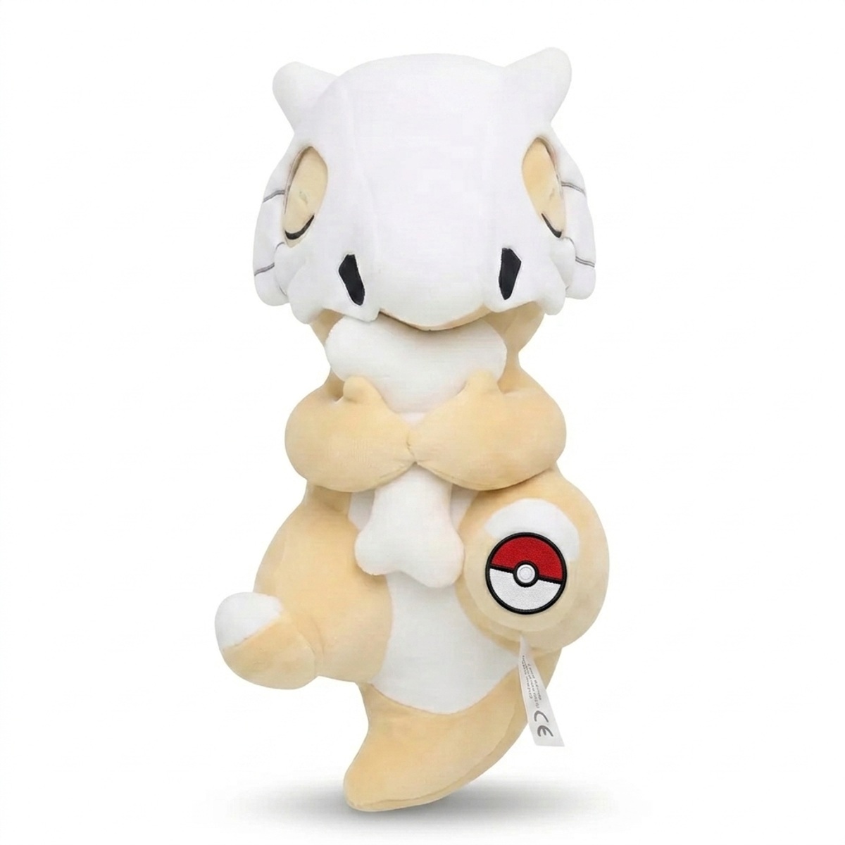 Cubone Peluche con insignia que prueba la autenticidad del producto.