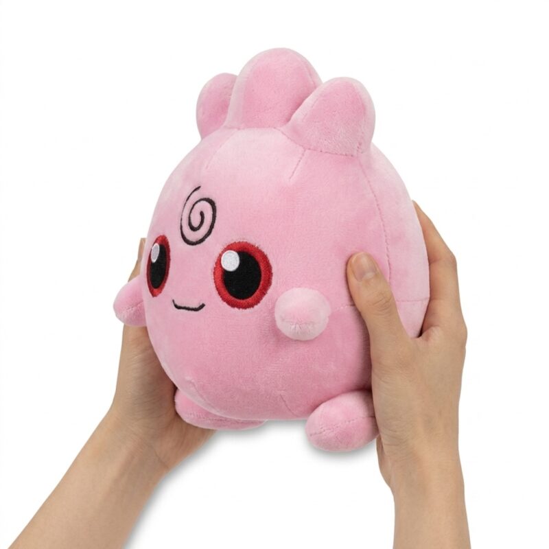 Igglybuff Peluche sostenida en las manos