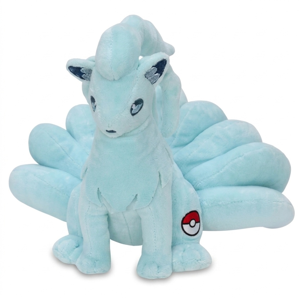 Ninetales Peluche con insignia que prueba la autenticidad del producto.