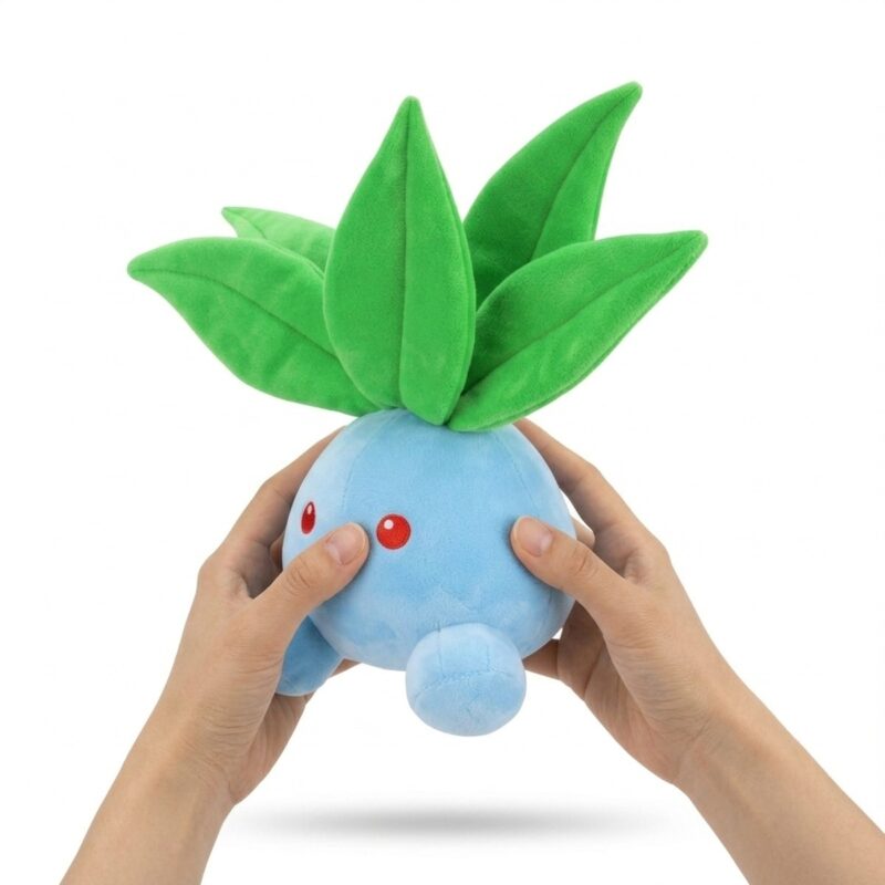 Oddish Peluche sostenido en las manos