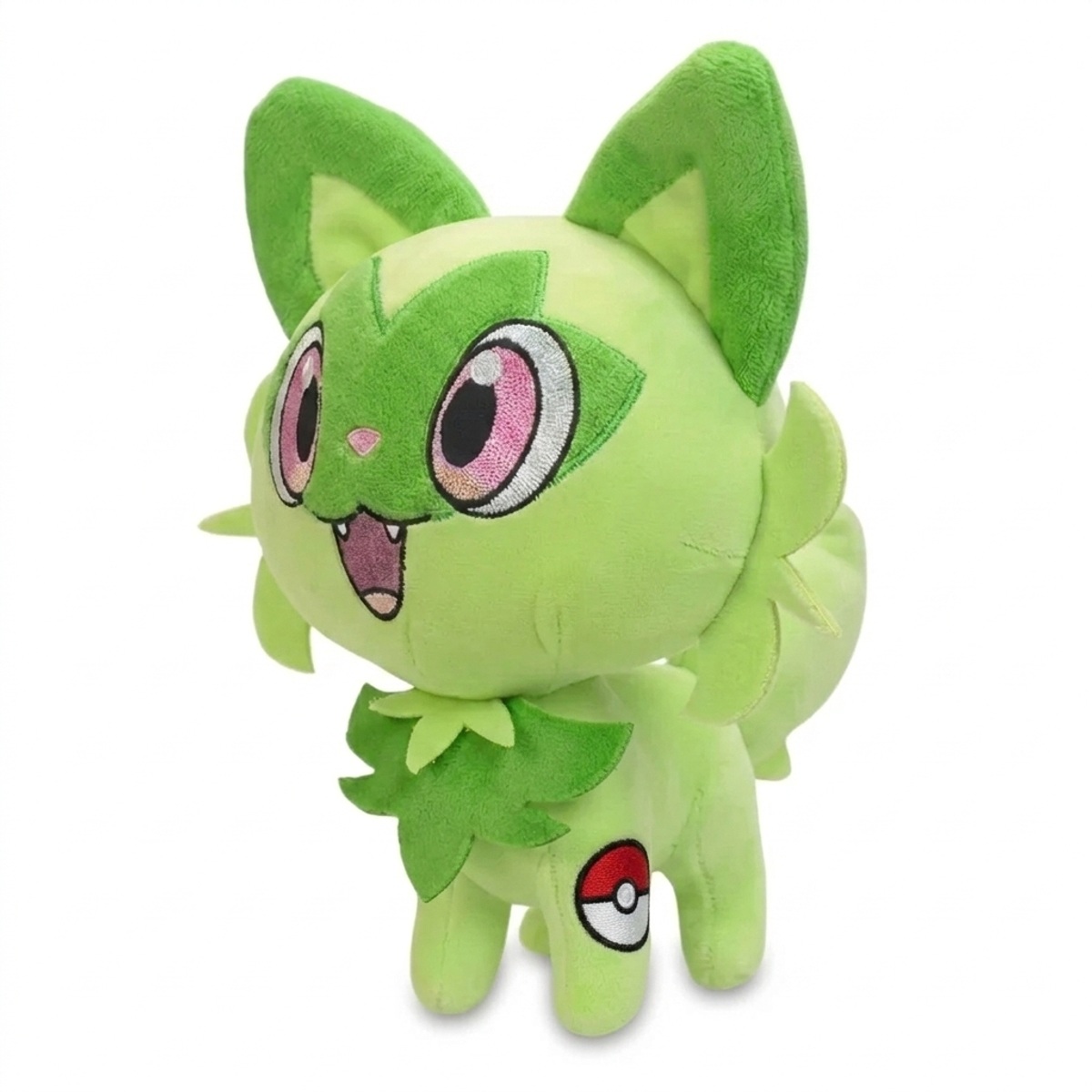 Sprigatito Peluche con insignia que prueba la autenticidad del producto.
