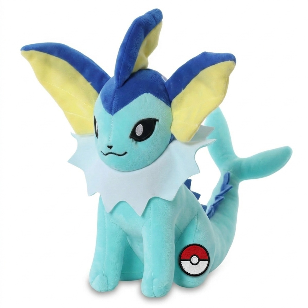 Vaporeon Peluche con insignia que prueba la autenticidad del producto.