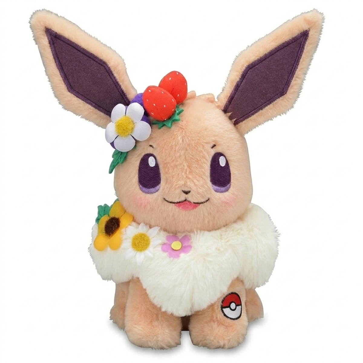 Eevee Peluche con insignia que prueba la autenticidad del producto.