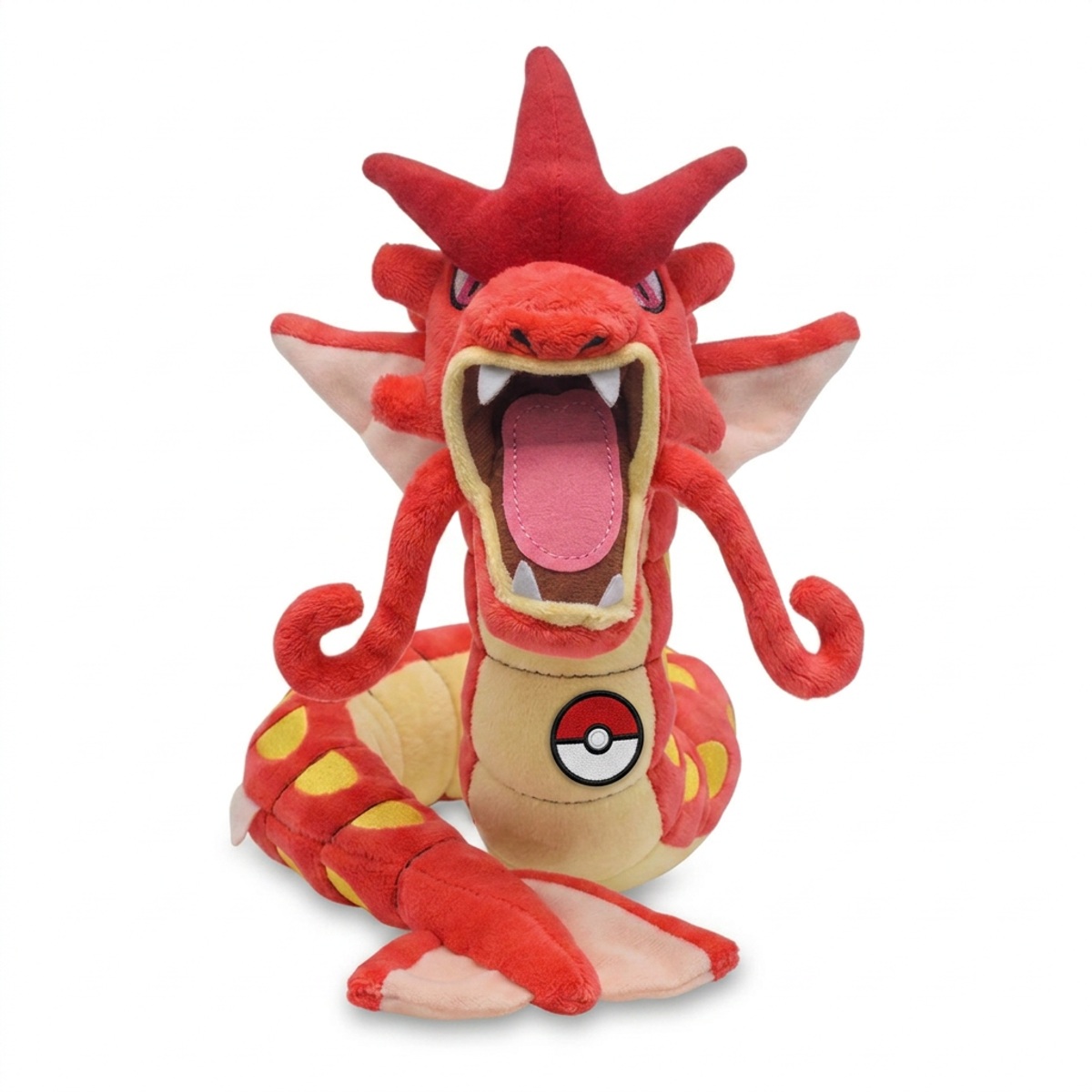 Gyarados Peluche con insignia que prueba la autenticidad del producto.