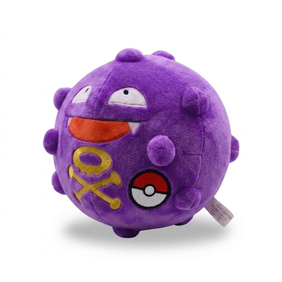 Koffing Peluche con insignia que prueba la autenticidad del producto.