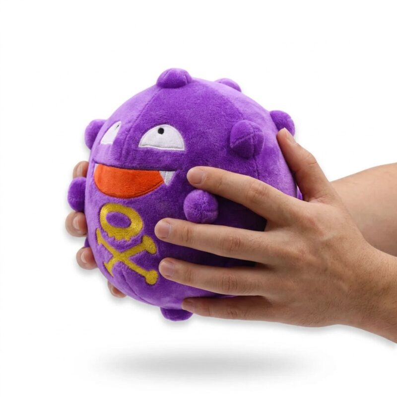 Koffing Peluche sostenido en las manos