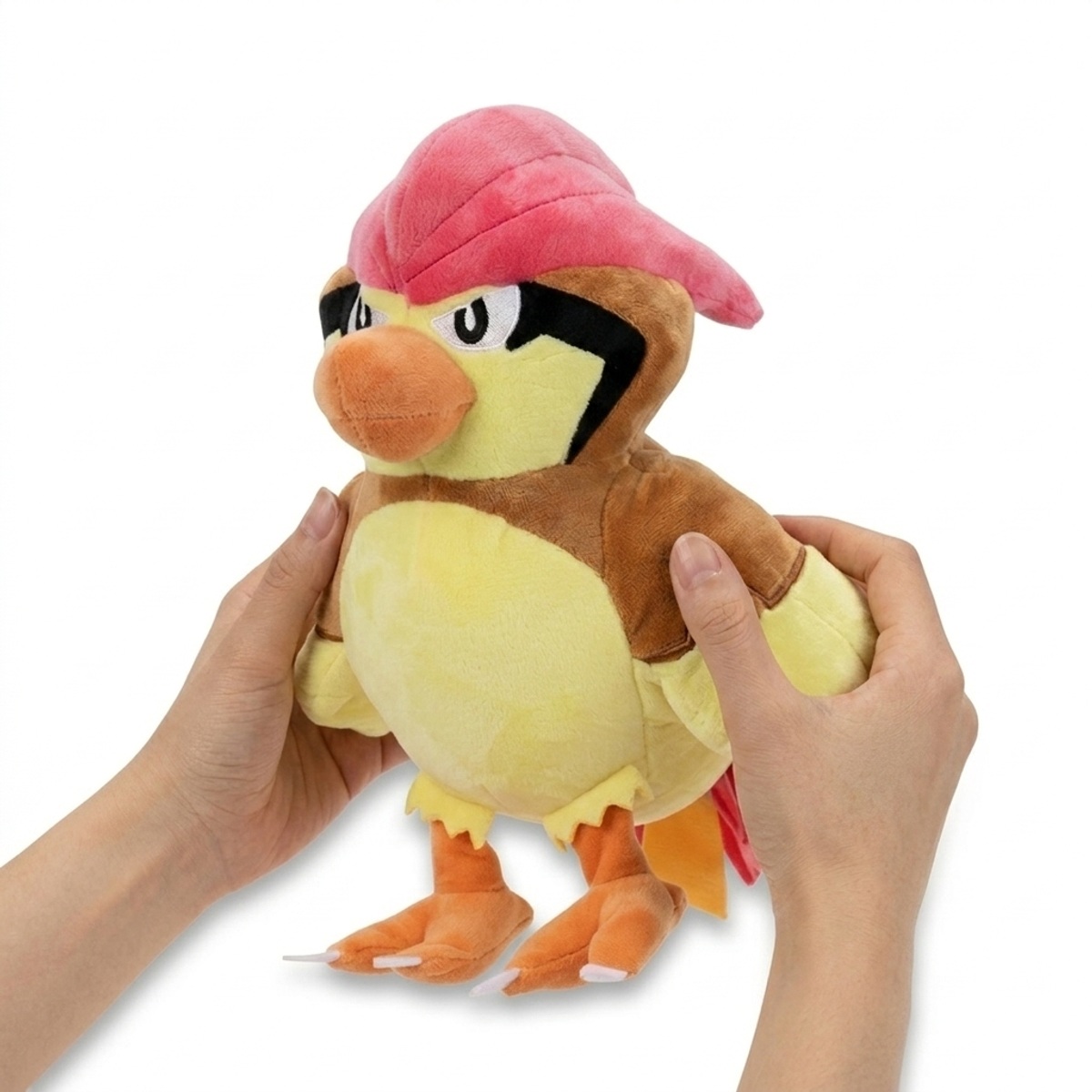 Pidgeotto Peluche sostenida en las manos