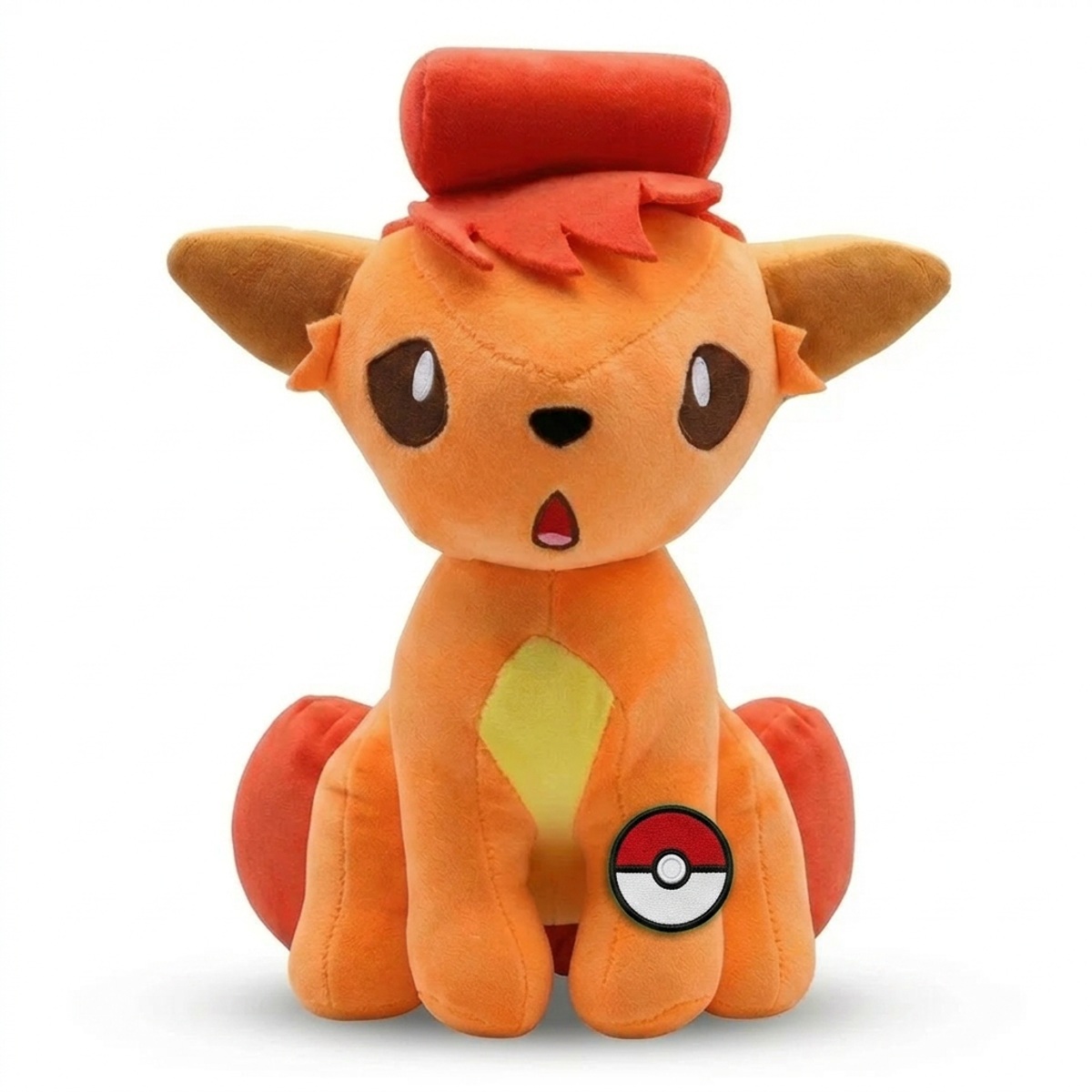 Vulpix Peluche con insignia que prueba la autenticidad del producto.