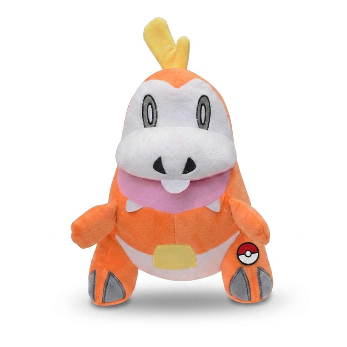 Fuecoco Peluche con insignia que prueba la autenticidad del producto.