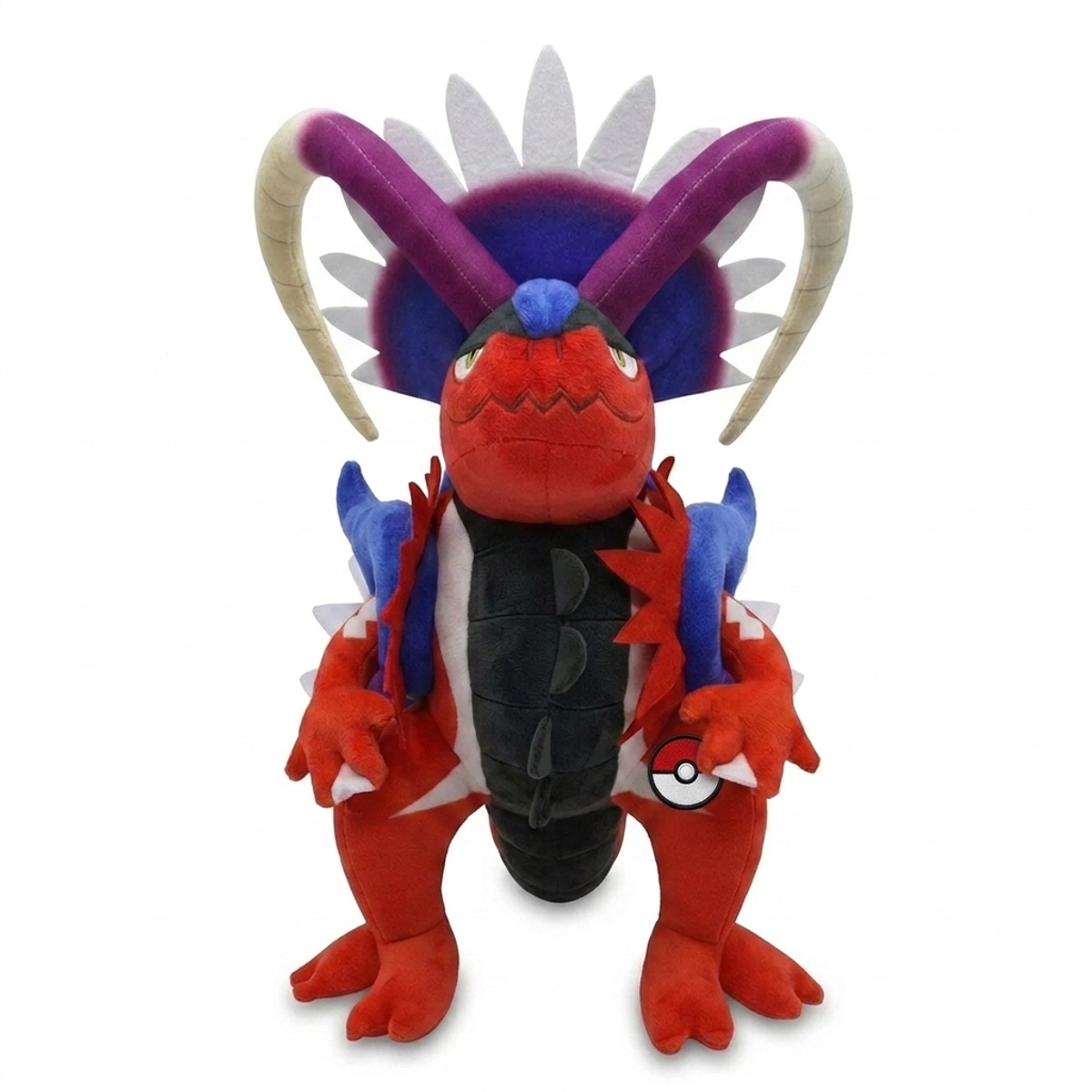 Koraidon Peluche con insignia que prueba la autenticidad del producto.
