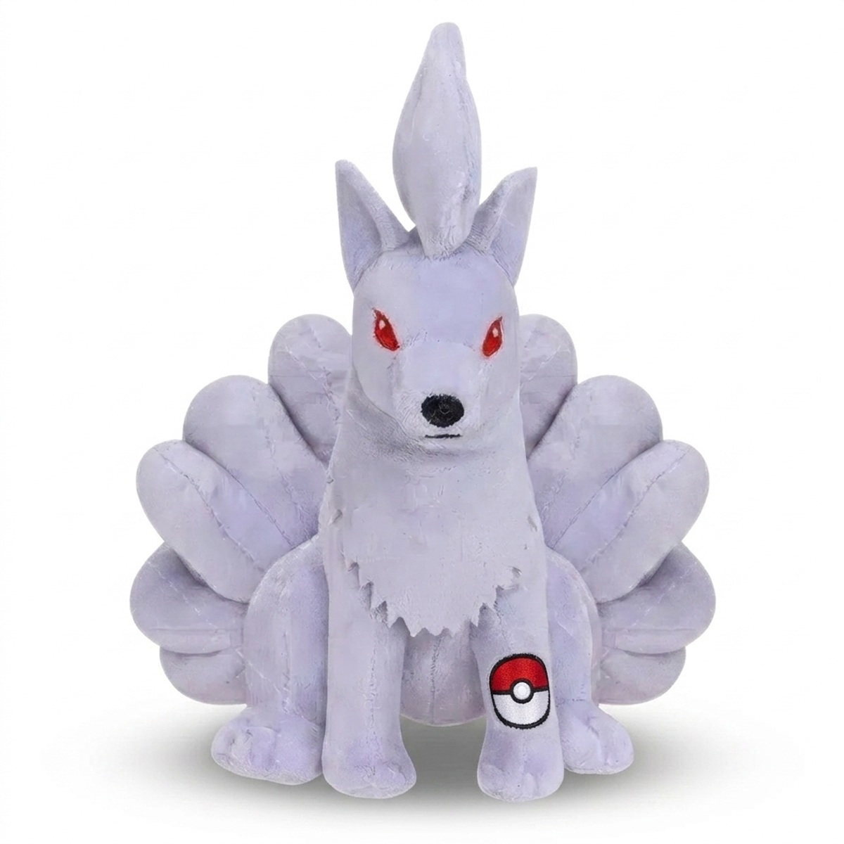 Ninetales Peluche con insignia que prueba la autenticidad del producto.