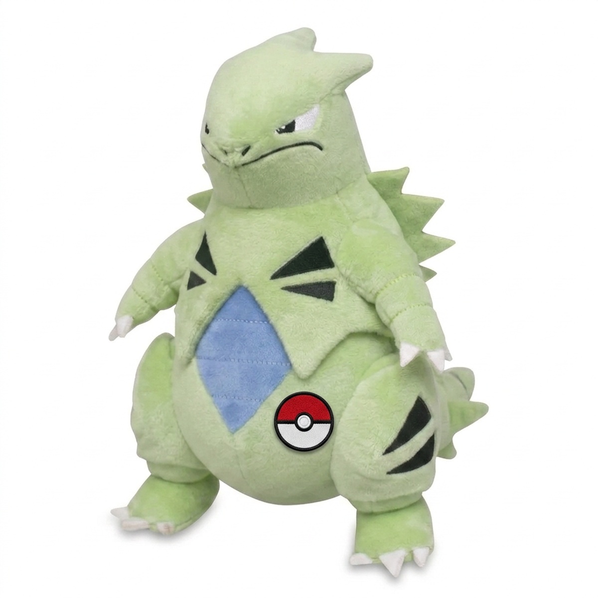 Tyranitar Peluche con insignia que prueba la autenticidad del producto.