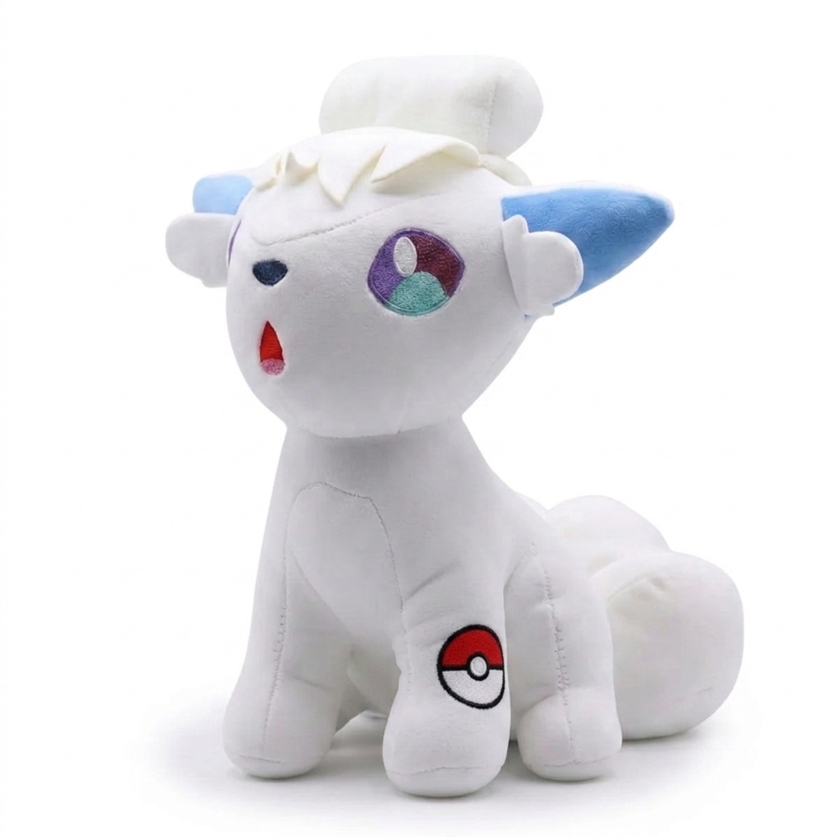 Vulpix Peluche con insignia que prueba la autenticidad del producto.